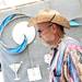 Artist Mike Rothfuss, of Ottowa Lake, stands in his booth along Main Street during the Guild's Ann Arbor Summer Art Fair on Thursday, July 18, 2013. Melanie Maxwell | AnnArbor.com